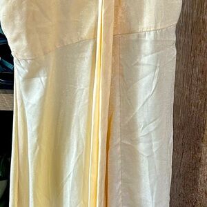 Very pale yellow silk dress eyelet buttons in front ties around neck can adjust